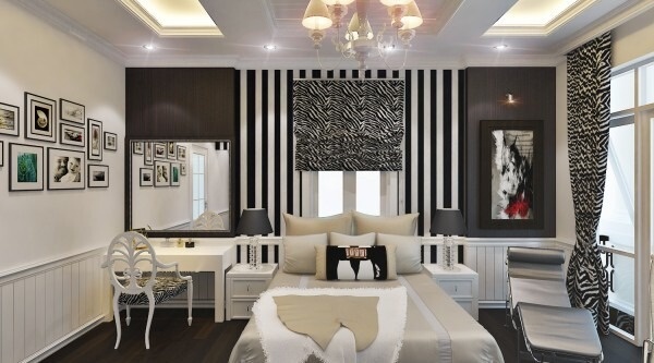 Phòng ngủ cổ điển với tông màu chủ đạo là trắng đen, sử dụng họa tiết trên nền trắng đen, thể hiện cá tính của gia chủ. Ghế đọc sách và những đường nét trang trí cong lượn tạo cảm giác hoài cổ.